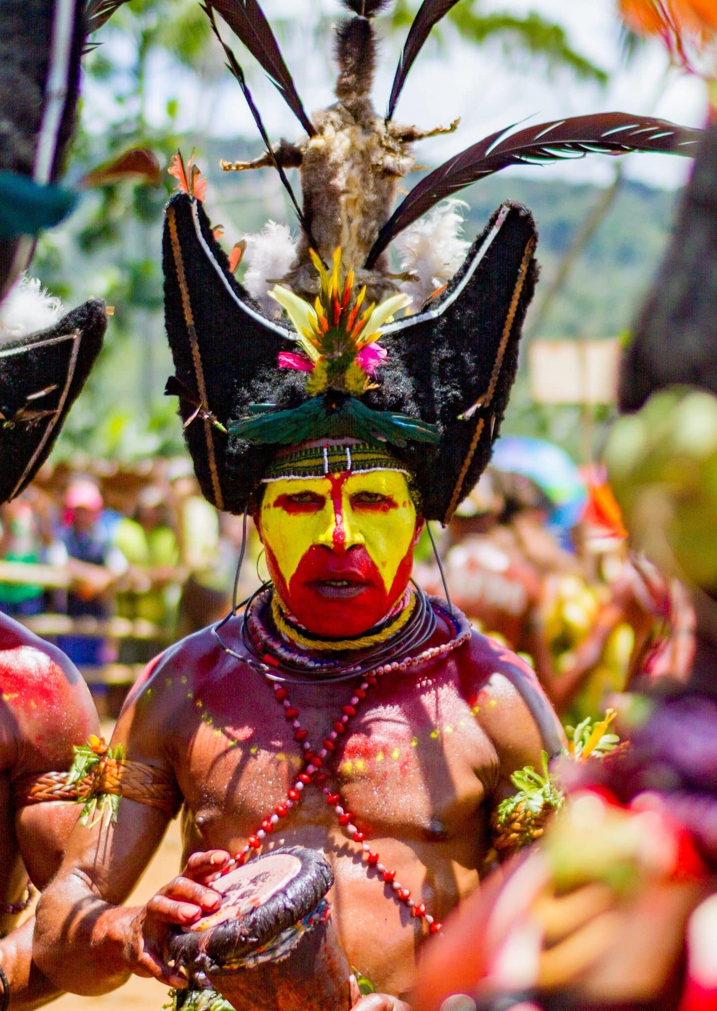 Photo of Papau New Guinea Man in headress by Jordan Donaldson for Unsplash