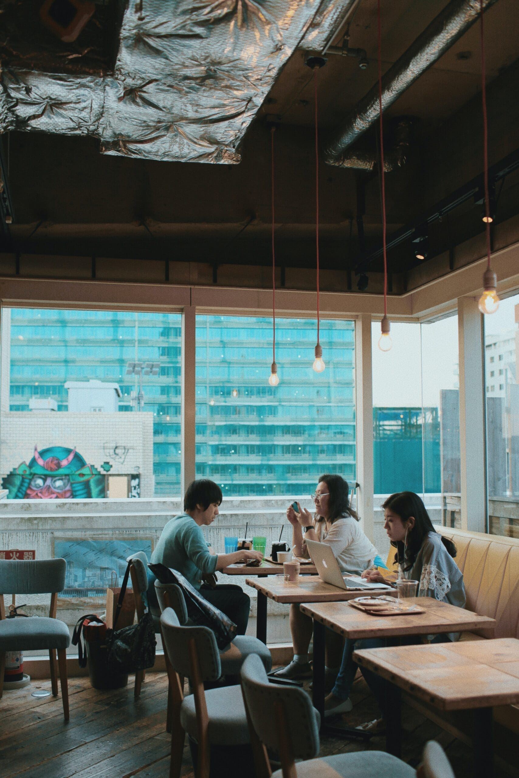 Photo of Japanese people eating in cafeteria by Linh Nguyen for Unsplash