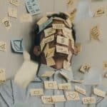 Photo of Man covered with sticky notes by Luis Villasmil for Unsplash