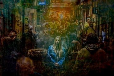 Photo of woman in crowd by Grae Dickason for Pixabay