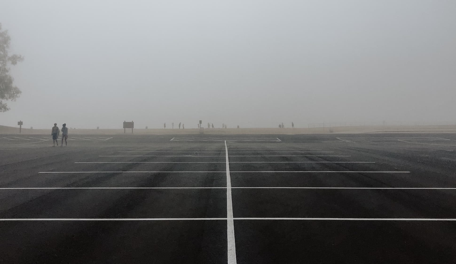 Photo of empty parking lot by Helen Cramer for Unsplash
