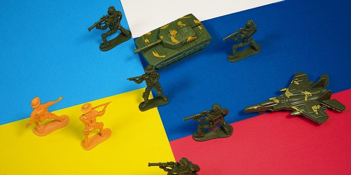 Photo of toy soldiers Ukraine Russia flags by Photo by FLY-D for Unsplash