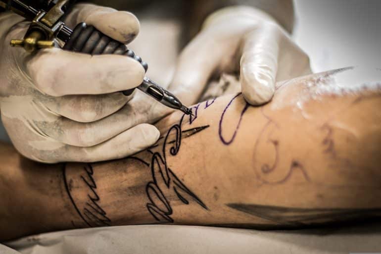 Photo of arm getting tattooed by Felix for Pixabay