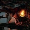 Photo of books in leaves with lantern by tengyart for unsplash