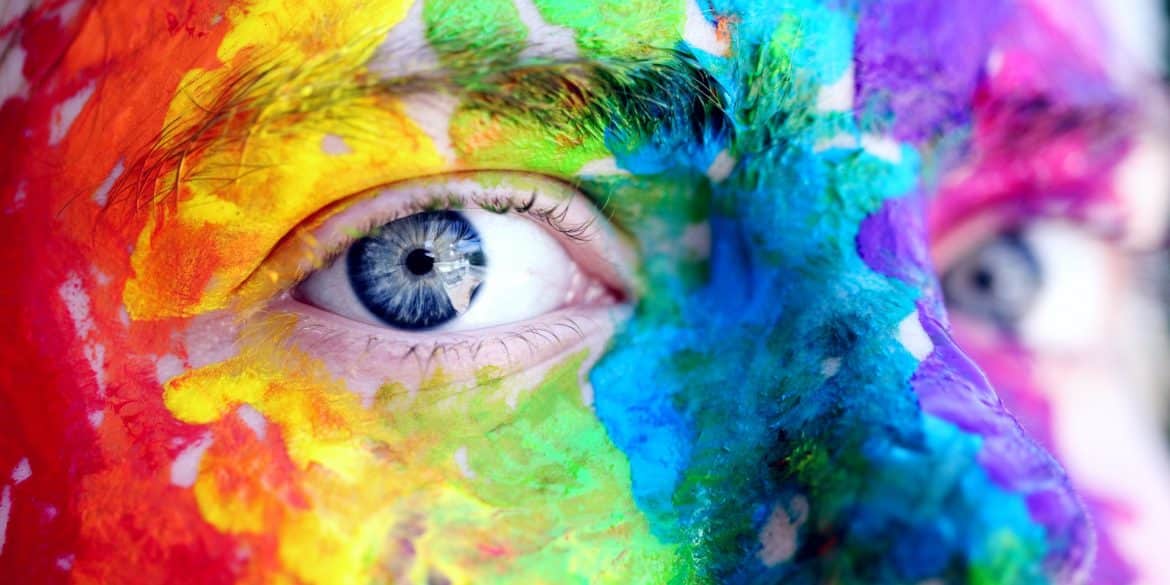 Photo of face painted in rainbow colors by Alexander Grey for Pexels.jpg