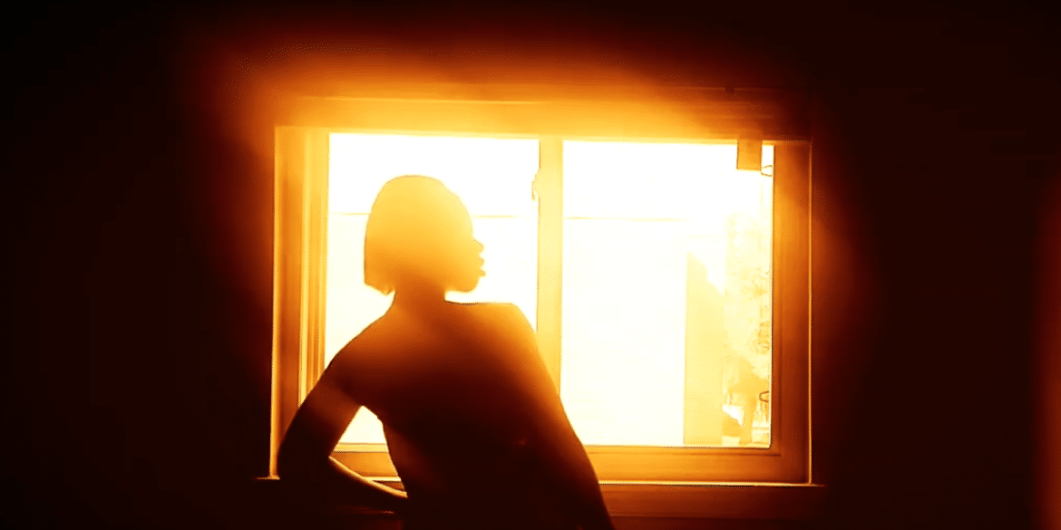 Photo of woman at window by Shanita Mitchell